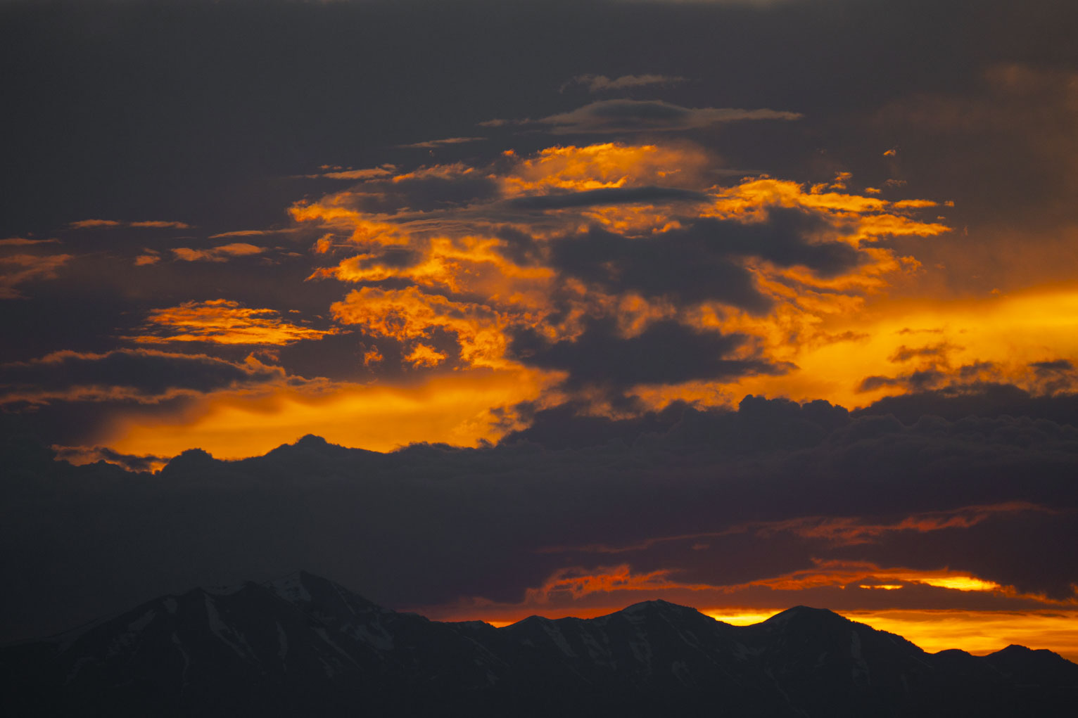 Dramatically lit sunset clouds over the mountains